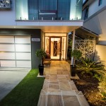 Modern-Architectural-new-home-brisbane-sandstone-entry-stairs-timber-pivot-door-lighting-driveway.jpg